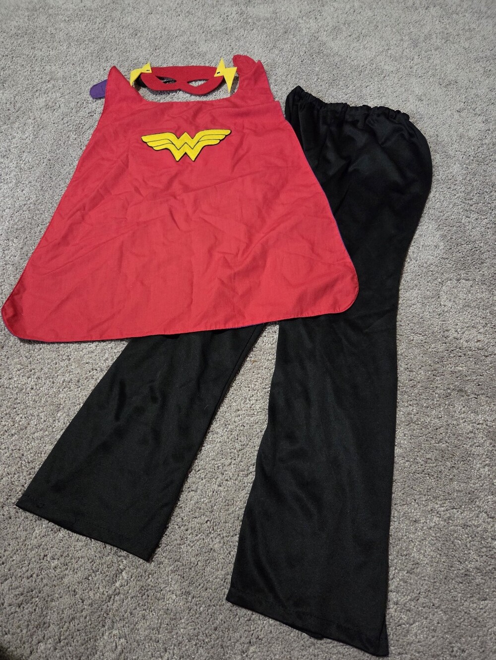 This is a DC Comics Wonder Woman costume set featuring a red satin-like cape acc